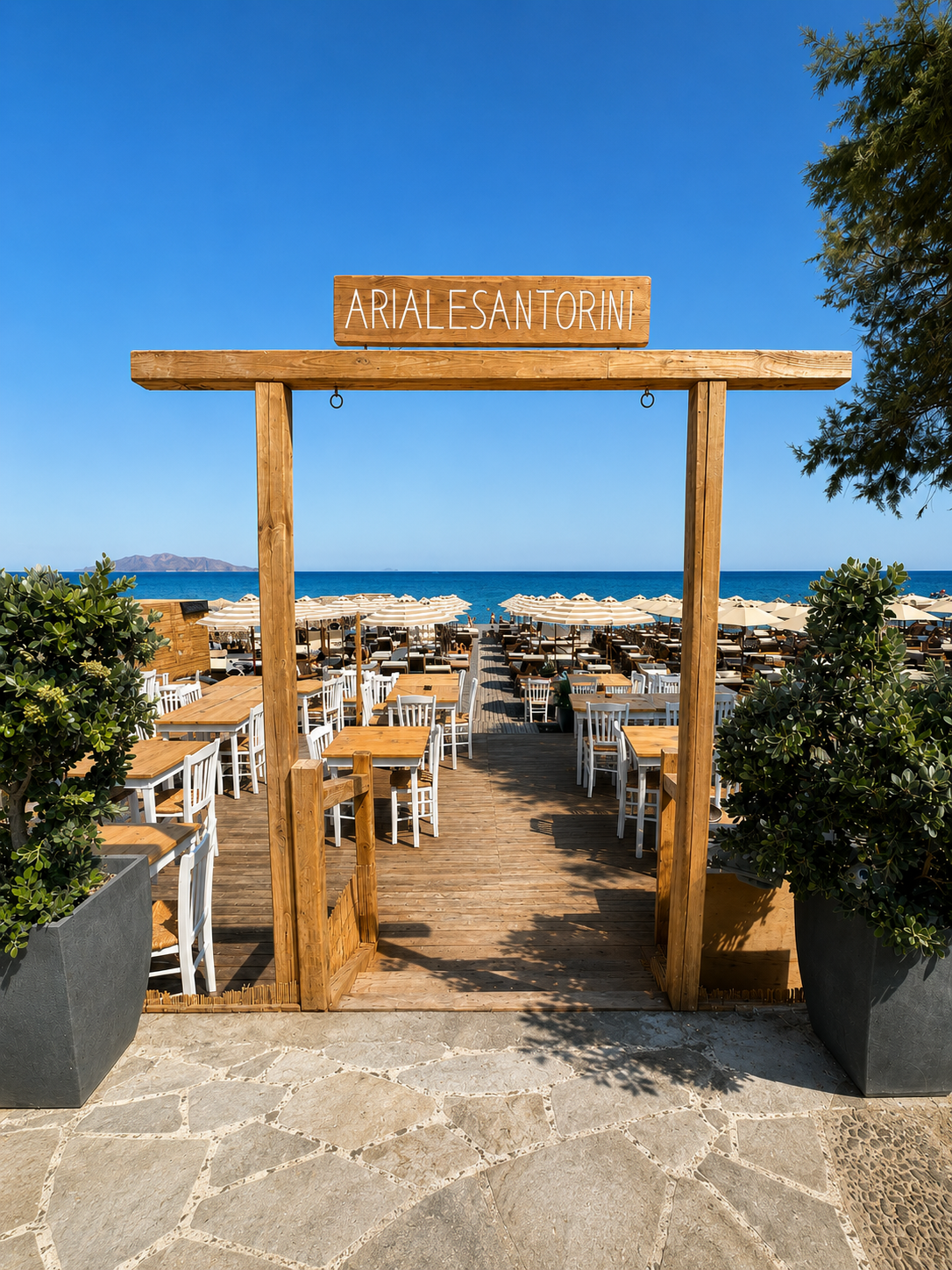 The wooden entrance to Ariale Beach overlooking the sea